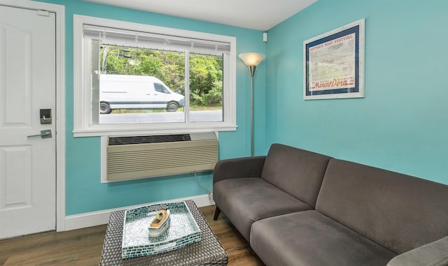 1144 Weirs Blvd Unit 20, Laconia, NH 03246 - living area featuring wood finished floors, baseboards, and a wall unit AC