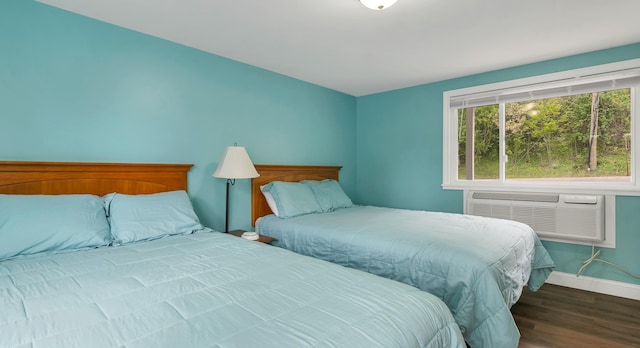 1144 Weirs Blvd Unit 20, Laconia, NH 03246 - bedroom featuring wood finished floors, baseboards, and a wall mounted air conditioner