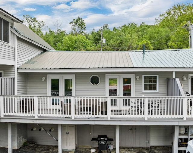 1144 Weirs Blvd Unit 20, Laconia, NH 03246 - back of house featuring metal roof