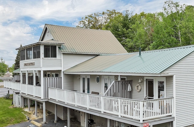 1144 Weirs Blvd Unit 20, Laconia, NH 03246 - back of property featuring metal roof