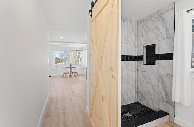 70 Broadway Dr, Amherst, NH 03031 - full bathroom featuring tiled shower, baseboards, and wood finished floors