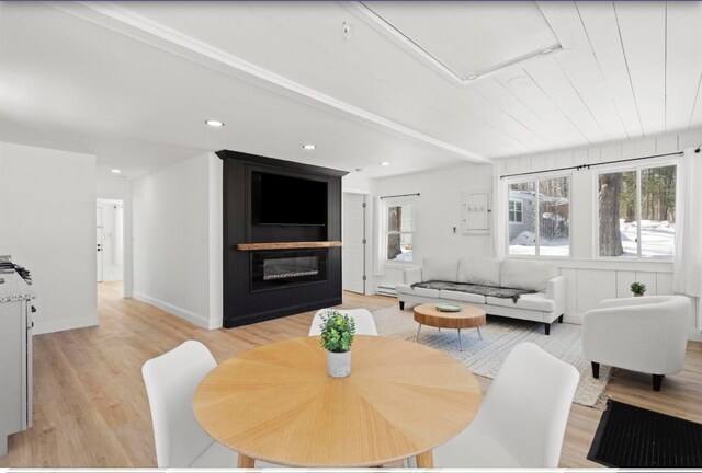 70 Broadway Dr, Amherst, NH 03031 - dining space featuring light wood-style flooring, a fireplace, recessed lighting, and a baseboard radiator