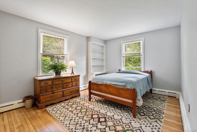 47 Dell Rd, Springfield, VT 05156 - bedroom with a baseboard radiator and light wood finished floors