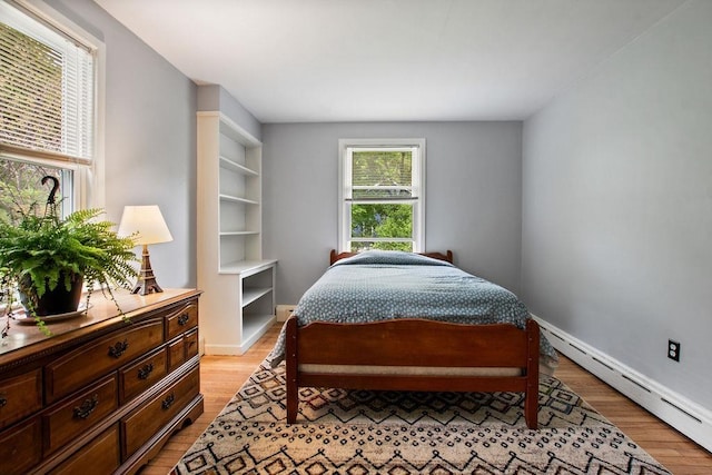 47 Dell Rd, Springfield, VT 05156 - bedroom with baseboard heating, light wood-style floors, and baseboards