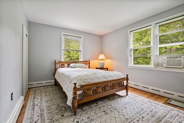 47 Dell Rd, Springfield, VT 05156 - bedroom with a baseboard heating unit, baseboard heating, multiple windows, and baseboards