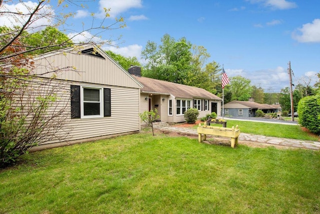 47 Dell Rd, Springfield, VT 05156 - single story home with a front yard and a chimney
