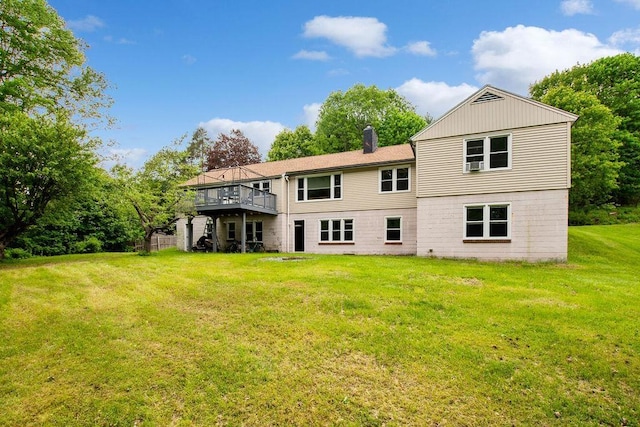 47 Dell Rd, Springfield, VT 05156 - rear view of house featuring a lawn, a wooden deck, and a chimney