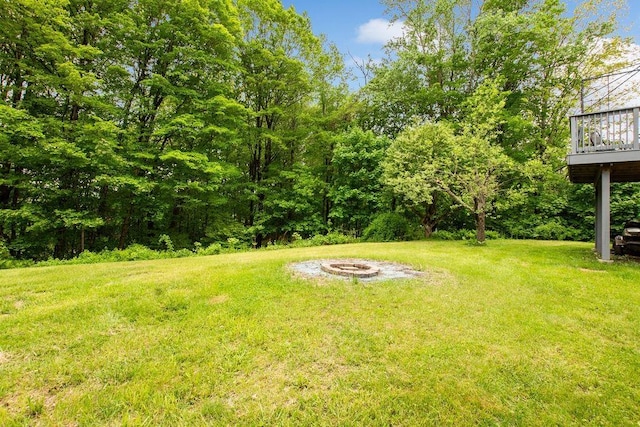 47 Dell Rd, Springfield, VT 05156 - view of grassy yard featuring a fire pit and a wooden deck