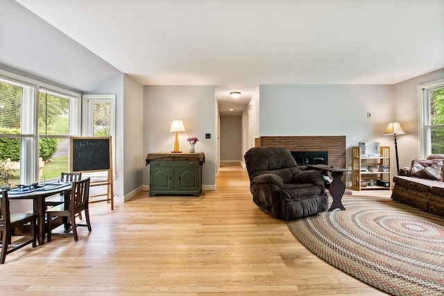 47 Dell Rd, Springfield, VT 05156 - living room with light wood-style floors, a fireplace, and baseboards