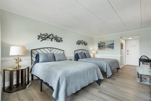 375 Endicott N St Unit 103, Laconia, NH 03246 - bedroom featuring wood finished floors and baseboards