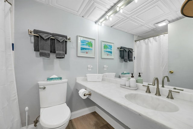 375 Endicott N St Unit 103, Laconia, NH 03246 - full bathroom with wood finished floors, toilet, vanity, curtained shower, and baseboards