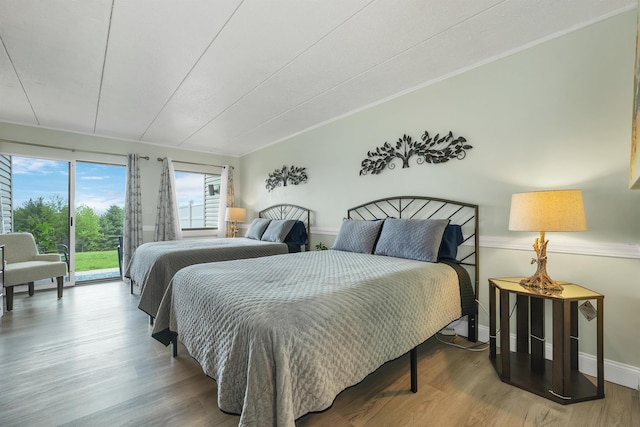 375 Endicott N St Unit 103, Laconia, NH 03246 - bedroom featuring access to outside, baseboards, and wood finished floors
