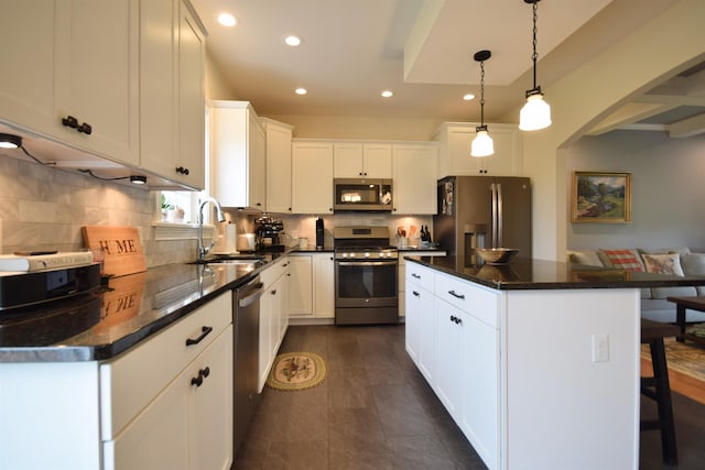 190 Ryans Way, Fletcher, VT 05448 - kitchen featuring appliances with stainless steel finishes, a sink, recessed lighting, a center island, and arched walkways