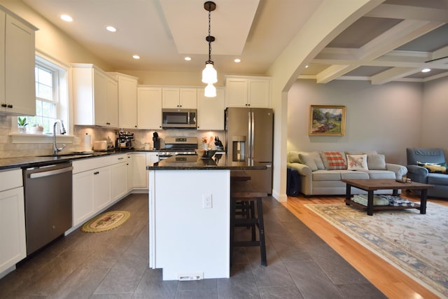 190 Ryans Way, Fletcher, VT 05448 - kitchen with stainless steel appliances, a sink, open floor plan, recessed lighting, and a kitchen breakfast bar