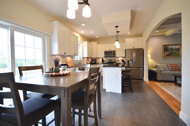 190 Ryans Way, Fletcher, VT 05448 - dining room featuring arched walkways, recessed lighting, and a chandelier