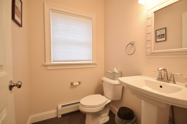 190 Ryans Way, Fletcher, VT 05448 - half bath with a baseboard heating unit, toilet, baseboards, tile patterned floors, and a sink