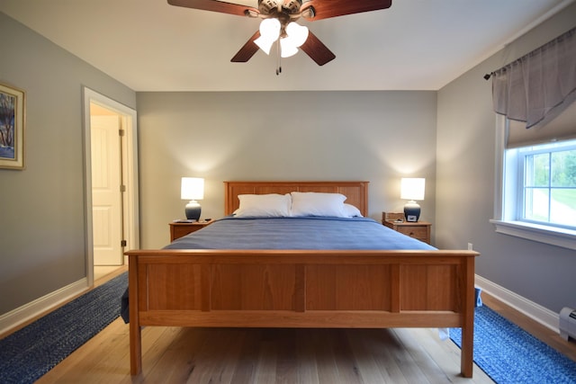 190 Ryans Way, Fletcher, VT 05448 - bedroom with wood finished floors, baseboards, ceiling fan, and a baseboard heating unit