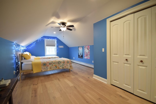 190 Ryans Way, Fletcher, VT 05448 - bedroom with a baseboard heating unit, light wood finished floors, baseboards, vaulted ceiling, and a ceiling fan