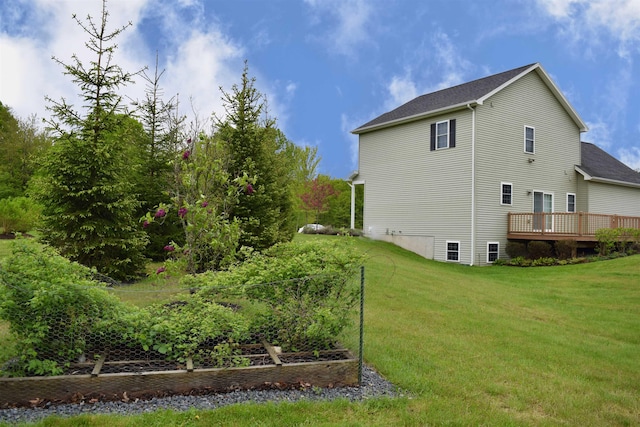 190 Ryans Way, Fletcher, VT 05448 - view of side of home featuring a yard, a garden, roof with shingles, and a deck