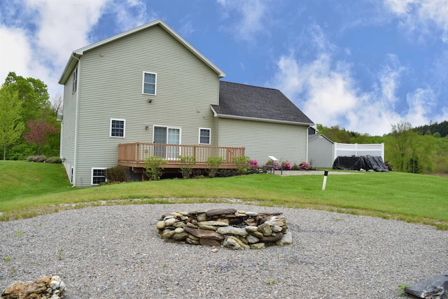 190 Ryans Way, Fletcher, VT 05448 - rear view of house with an outdoor fire pit, a deck, a lawn, and a shingled roof