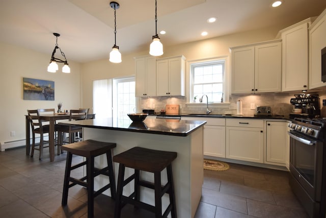 190 Ryans Way, Fletcher, VT 05448 - kitchen with stainless steel range with gas cooktop, plenty of natural light, backsplash, and recessed lighting