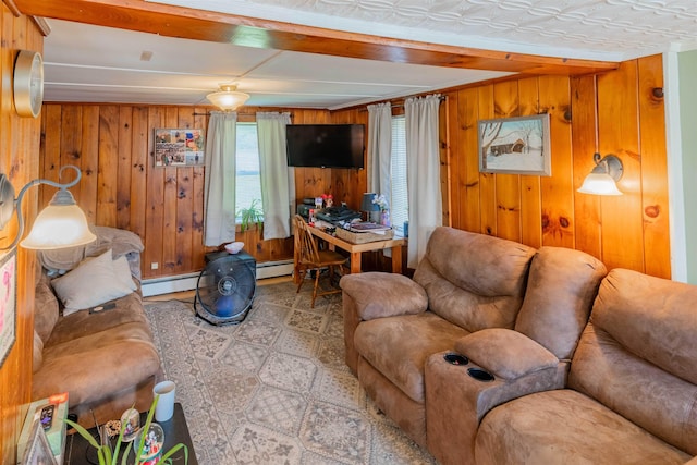 95 Main St, Wells River, VT 05081 - living area with wooden walls, beam ceiling, and a baseboard heating unit