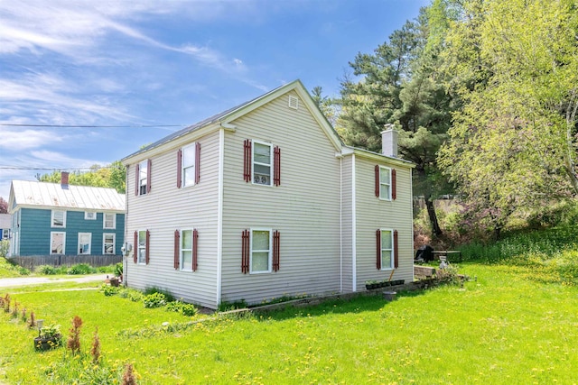 95 Main St, Wells River, VT 05081 - view of side of home featuring a yard and a chimney