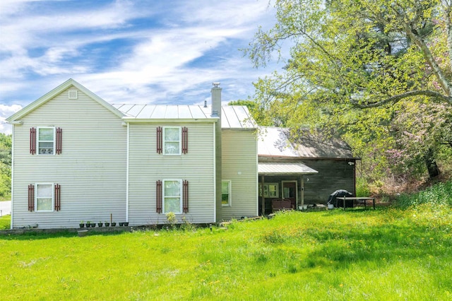 95 Main St, Wells River, VT 05081 - rear view of house featuring a standing seam roof, a chimney, and metal roof