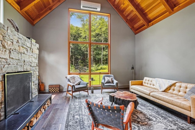 249 Falls Brook Ln, Stowe, VT 05672 - living room with wooden ceiling with exposed beams, hardwood / wood-style flooring, a wall mounted AC, a fireplace, and baseboards