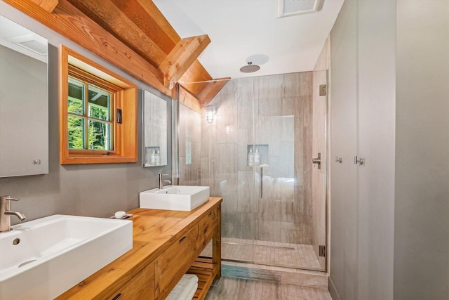 249 Falls Brook Ln, Stowe, VT 05672 - full bathroom with a stall shower, double vanity, and wood finished floors