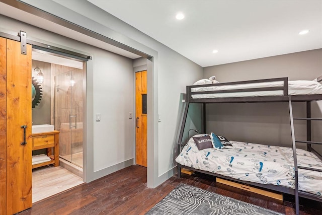 249 Falls Brook Ln, Stowe, VT 05672 - bedroom with wood finished floors, recessed lighting, baseboards, and a barn door