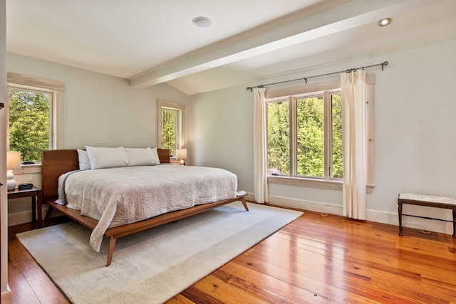 87 Deerpath Rd, New London, NH 03257 - bedroom with light wood-style flooring, beam ceiling, and baseboards