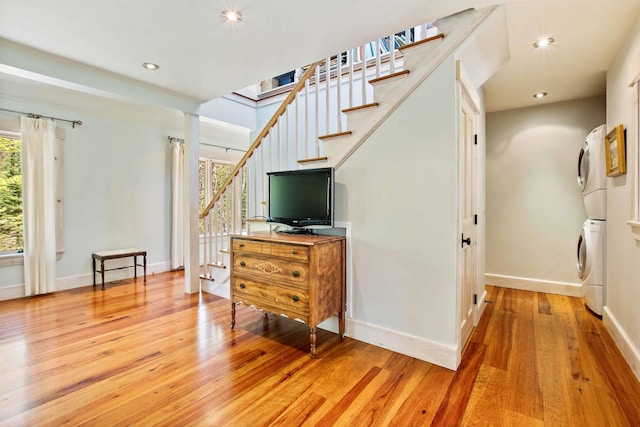 87 Deerpath Rd, New London, NH 03257 - living room featuring estacked washer and dryer, stairs, light wood-style floors, baseboards, and recessed lighting