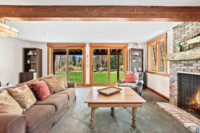 87 Deerpath Rd, New London, NH 03257 - living area with carpet flooring, a fireplace, and baseboards