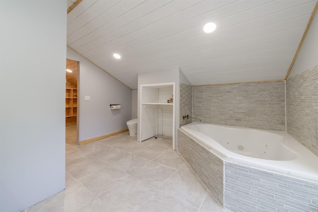 140 Thurber Rd, Unity, NH 03773 - full bathroom with vaulted ceiling, a whirlpool tub, toilet, tile patterned flooring, and recessed lighting