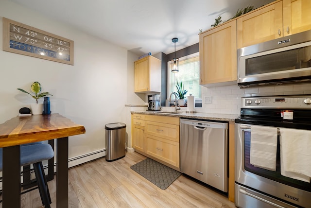 205 Circle Rd Unit 2, Manchester, NH 03103 - kitchen with appliances with stainless steel finishes, light brown cabinets, and a sink