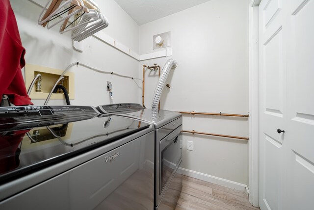 205 Circle Rd Unit 2, Manchester, NH 03103 - laundry room featuring separate washer and dryer, light wood finished floors, and baseboards