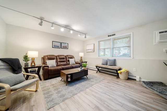 205 Circle Rd Unit 2, Manchester, NH 03103 - living area with track lighting, a baseboard radiator, and light wood finished floors
