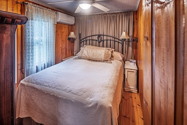22 Kingsbury Dr, Milton, NH 03851 - bedroom featuring an AC wall unit, wooden walls, and ceiling fan
