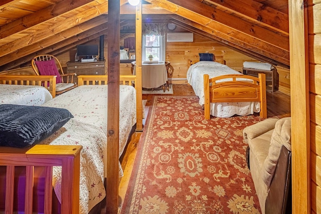 22 Kingsbury Dr, Milton, NH 03851 - bedroom featuring lofted ceiling, wood walls, a wall mounted air conditioner, and wood finished floors
