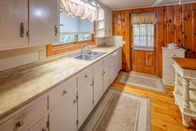 22 Kingsbury Dr, Milton, NH 03851 - kitchen featuring a sink, white dishwasher, light wood-style flooring, white cabinetry, and light countertops