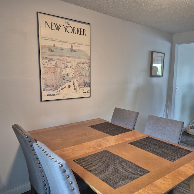 16 Oakwood Dr Unit 16, Claremont, NH 03743 - dining area featuring a textured ceiling