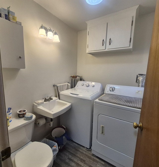 16 Oakwood Dr Unit 16, Claremont, NH 03743 - washroom featuring washing machine and clothes dryer and dark wood-style floors