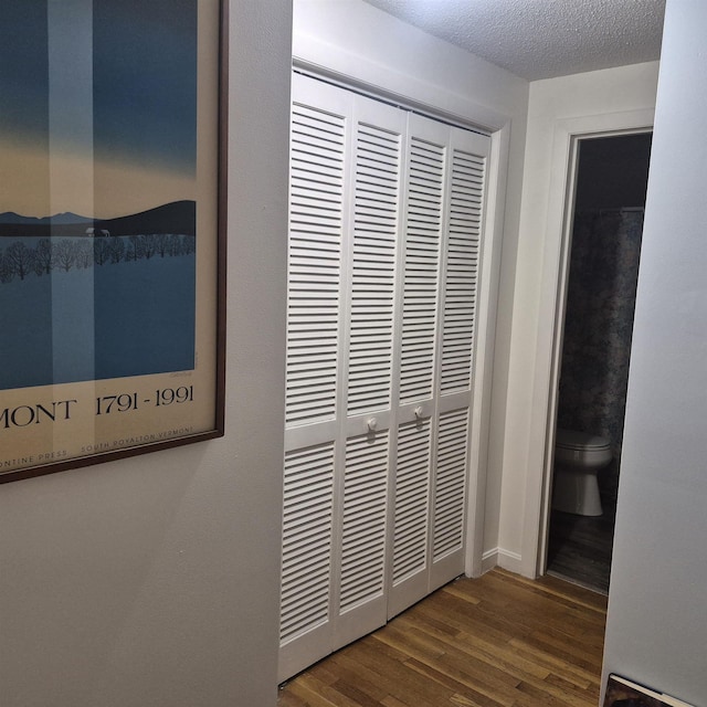 16 Oakwood Dr Unit 16, Claremont, NH 03743 - detailed view of wood finished floors and a textured ceiling