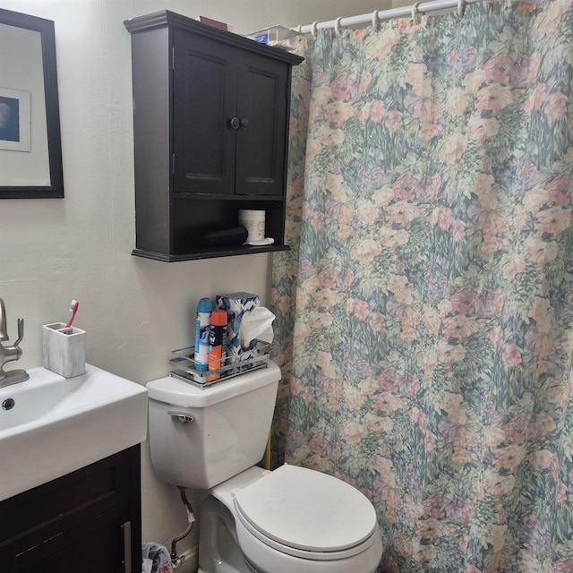 16 Oakwood Dr Unit 16, Claremont, NH 03743 - bathroom featuring toilet, vanity, and a shower with shower curtain
