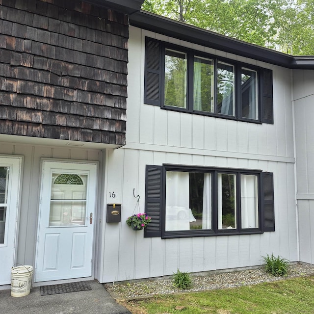 16 Oakwood Dr Unit 16, Claremont, NH 03743 - doorway to property featuring board and batten siding