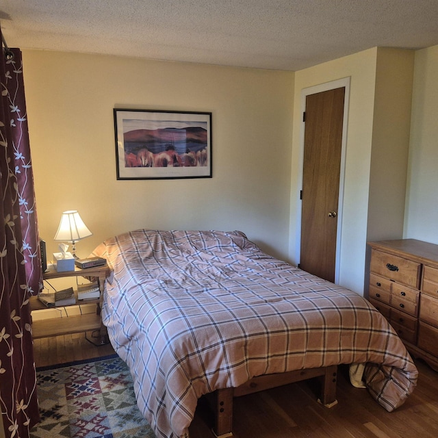 16 Oakwood Dr Unit 16, Claremont, NH 03743 - bedroom featuring wood finished floors and a textured ceiling
