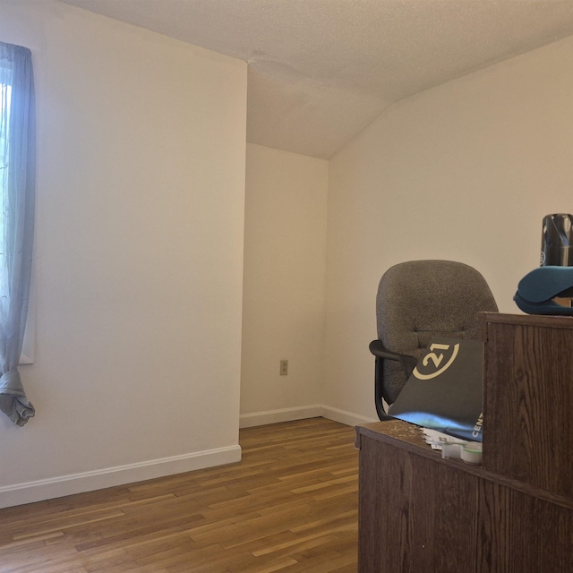 16 Oakwood Dr Unit 16, Claremont, NH 03743 - office space featuring wood finished floors, baseboards, and lofted ceiling