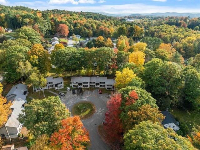 16 Oakwood Dr Unit 16, Claremont, NH 03743 - aerial view of property and surrounding area featuring a heavily wooded area