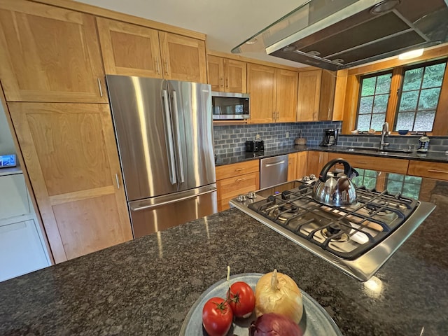 32 Christie Ln, Brattleboro, VT 05301 - kitchen with stainless steel appliances, a sink, exhaust hood, tasteful backsplash, and dark stone counters